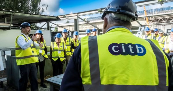 Apprentices practising trade skills in a construction training workshop